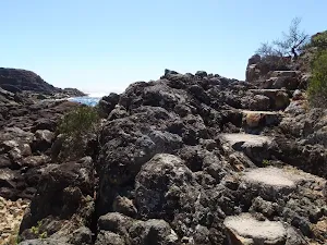 Stairs out of rocky beach