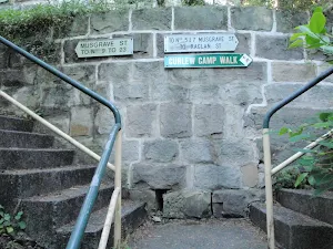A few signs mark the way