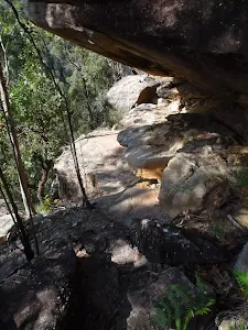 Track beneath overhang
