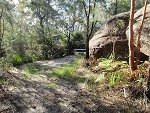 Gate and rock at the start of split rock trail