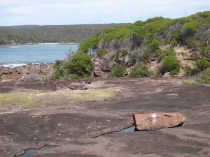 Following white arrows painted on the rocks