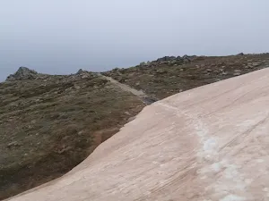 Traversing the remaining snow along the track