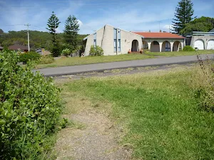 Track with Caves Beach Road in the distance