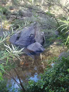 Boulder in water