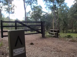 using the stile to cross the farms fence
