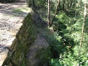 A retaining wall supporting Shepherd's Gully road