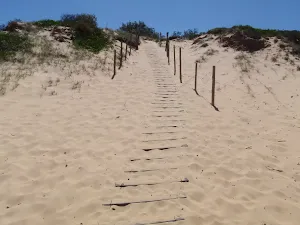 Track down dunes onto Wallagoot Beach