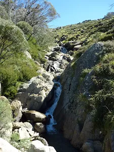 Passing a small fall beside the trail on Merritts Traverse