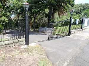 Gates at the top of driveway to Stricland House