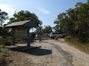 Sign and gate at the end of Beachcomber Rd