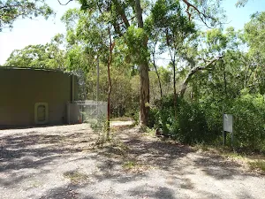 Large green water tank on the Wallarah Pennisula Walk near Murray's Beach