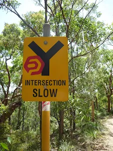 yellow sign showing 'Intersection Slow' near Murray's beach