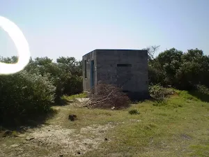 Historic concrete building on coast cemetery trail