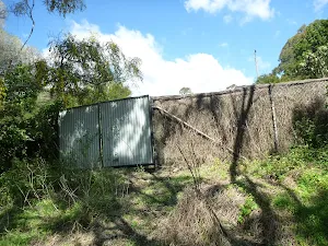 Private fence next to Perimeter Trail