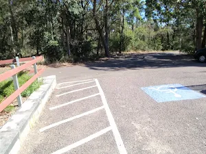 One of a few carparks next to the mud brick building