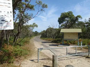 Sign and gate at the end of Beachcomber Rd