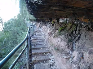 Duck under this overhang on National Pass