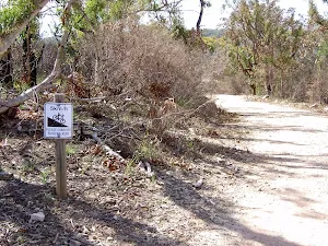 Steep signpost on The Basin service trail
