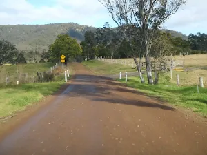 following the road winding through farmland