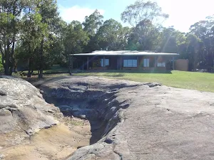 Looking across Honeman's Rock to the Mud Brick Building