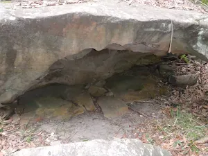 Rock overhang next to track