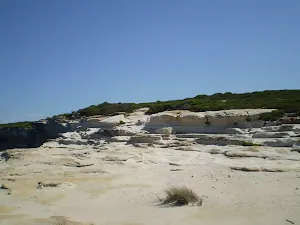 Climbing up to the southern headland of Marley Beach
