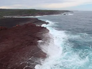 Water running off the red rock