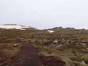continuing along the metal walkway